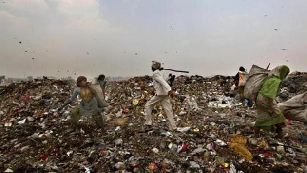 The height of the Ghazipur landfill is about 50 metres though the permissible limit for the height of a landfill is only 20 metres.((Raj K Raj/HT Photo))