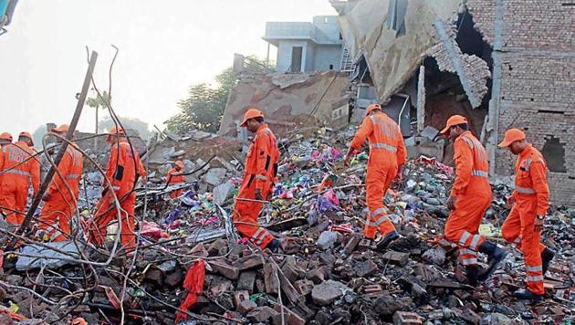 National Disaster Response Force (NDRF) personnel at the site in Sular-Gharat village in Sangrur on Wednesday. (Bharat Bhushan/HT) National Disaster Response Force (NDRF) personnel at the site in Sular-Gharat village in Sangrur on Wednesday. (Bharat Bhushan/HT)