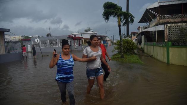 Inhabitants walk in flood water from the Puerto Nuevo river during the passage of Hurricane Maria, in San Juan. ‘This might be a new, permanent part of our lives,’ said Ramon Claudio Ortiz, 71, a retired lawyer. ‘We’re going to have to revisit our building codes.’ Maria was the second-strongest hurricane ever recorded to make landfall in Puerto Rico, behind the 1928 San Felipe Segundo hurricane, which struck the island as a Category 5 storm and killed more than 300 people. (Hector Retamal / AFP) Inhabitants walk in flood water from the Puerto Nuevo river during the passage of Hurricane Maria, in San Juan. ‘This might be a new, permanent part of our lives,’ said Ramon Claudio Ortiz, 71, a retired lawyer. ‘We’re going to have to revisit our building codes.’ Maria was the second-strongest hurricane ever recorded to make landfall in Puerto Rico, behind the 1928 San Felipe Segundo hurricane, which struck the island as a Category 5 storm and killed more than 300 people. (Hector Retamal / AFP)