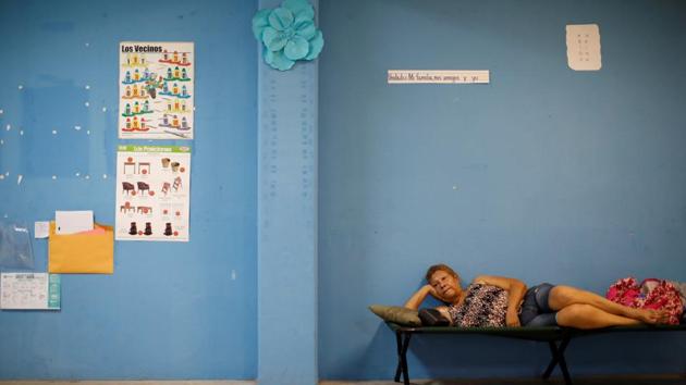 As people waited in shelters or took cover inside stairwells, bathrooms and closets, Maria brought down cell towers and power lines, snapped trees, tore off roofs and unloaded at least 20 inches (50 centimeters) of rain. ‘Once we’re able to go outside, we’re going to find our island destroyed,’ warned Abner Gomez, Puerto Rico’s emergency management director. ‘The information we have received is not encouraging. It’s a system that has destroyed everything in its path.’ (Carlos Garcia Rawlins / REUTERS) As people waited in shelters or took cover inside stairwells, bathrooms and closets, Maria brought down cell towers and power lines, snapped trees, tore off roofs and unloaded at least 20 inches (50 centimeters) of rain. ‘Once we’re able to go outside, we’re going to find our island destroyed,’ warned Abner Gomez, Puerto Rico’s emergency management director. ‘The information we have received is not encouraging. It’s a system that has destroyed everything in its path.’ (Carlos Garcia Rawlins / REUTERS)