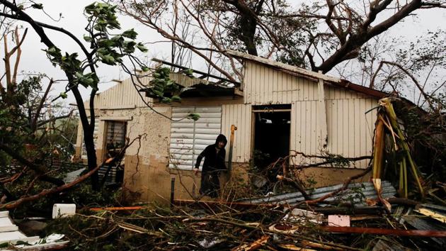 A man looks for valuables in the damaged house of a relative after the area was hit by Hurricane Maria in Guayama, Puerto Rico September 20, 2017. Hurricane Maria, the strongest storm to strike Puerto Rico in nearly 90 years, carved a path of destruction as it ripped through the US territory, causing severe flooding and plunging the island into darkness as the storm’s death toll in the Caribbean rose to at least 10. (Carlos Garcia Rawlins / REUTERS) A man looks for valuables in the damaged house of a relative after the area was hit by Hurricane Maria in Guayama, Puerto Rico September 20, 2017. Hurricane Maria, the strongest storm to strike Puerto Rico in nearly 90 years, carved a path of destruction as it ripped through the US territory, causing severe flooding and plunging the island into darkness as the storm’s death toll in the Caribbean rose to at least 10. (Carlos Garcia Rawlins / REUTERS)