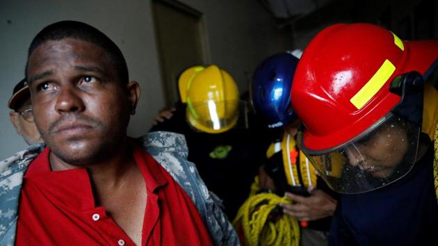Rescue workers pray before walking out from the Emergency Operation Centre during Hurricane Maria in Guayama, Puerto Rico September 20, 2017. More than 11,000 people — and more than 580 pets — were in shelters, authorities said. Governor Ricardo Rossello urged people to have faith: ‘We are stronger than any hurricane. Together, we will rebuild.’ He asked President Donald Trump to declare the island a disaster zone, a step that would open the way to federal aid. (Carlos Garcia Rawlins / REUTERS) Rescue workers pray before walking out from the Emergency Operation Centre during Hurricane Maria in Guayama, Puerto Rico September 20, 2017. More than 11,000 people — and more than 580 pets — were in shelters, authorities said. Governor Ricardo Rossello urged people to have faith: ‘We are stronger than any hurricane. Together, we will rebuild.’ He asked President Donald Trump to declare the island a disaster zone, a step that would open the way to federal aid. (Carlos Garcia Rawlins / REUTERS)