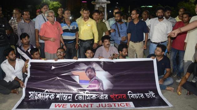 This September 20, 2017 photo shows journalists at a road blockade set up over the killing of journalist Shantanu Bhowmick in front of the chief minister's residence in Agartala.(AFP)