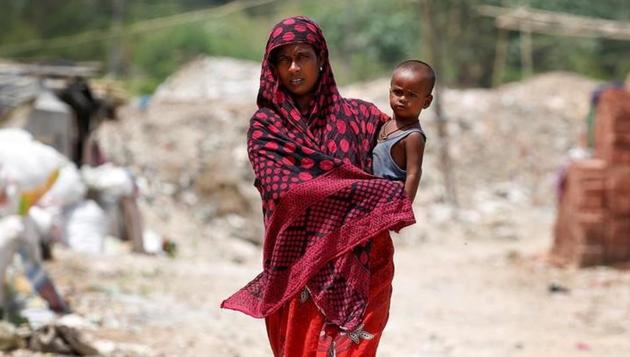A woman from the Rohingya community walks through a camp in Delhi. (Reuters) A woman from the Rohingya community walks through a camp in Delhi. (Reuters)