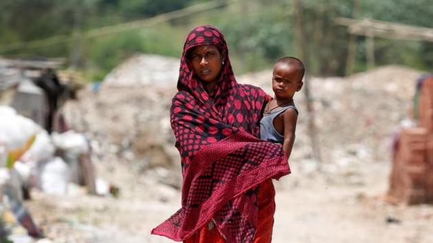 A woman from the Rohingya community walks through a camp in Delhi, India August 17, 2017. REUTERS/Cathal McNaughton/Files (Reuters) A woman from the Rohingya community walks through a camp in Delhi, India August 17, 2017. REUTERS/Cathal McNaughton/Files (Reuters)