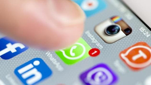 A phone screen shows social media applications of WhatsApp, Facebook, Instagram, Viber, Linkedin, Tango, Perisfind and Snapchat.(Getty Images)