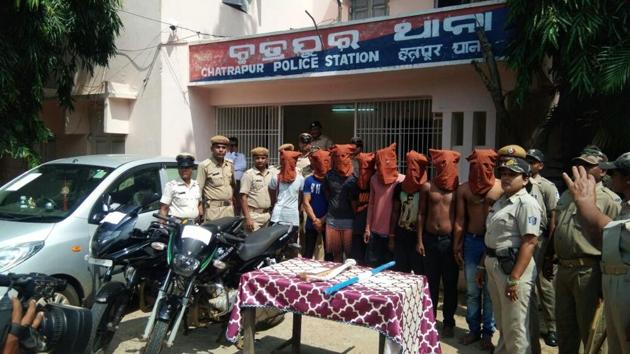 Odisha Police with the eight men arrested for the murder of a BJD councillor in Chhatrapur Notified Area Council in Ganjam district. (HT PHOTO) Odisha Police with the eight men arrested for the murder of a BJD councillor in Chhatrapur Notified Area Council in Ganjam district. (HT PHOTO)