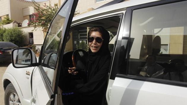 Azza Al Shmasani alights from her car after driving in defiance of the ban in Riyadh, Saudi Arabia in 2011.(Reuters File Photo)