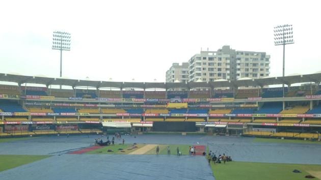 The Holkar Stadium in Indore under cover to protect the ground from rain.(HT Photo)