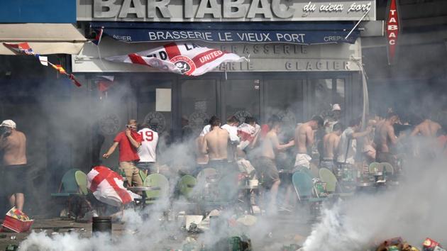 MARSEILLE, FRANCE - JUNE 11: England fans react after police sprayed tear gas during clashes ahead of the game against Russia on June 11, 2016 in Marseille, France. Manchester United and Liverpool supporters travelling to Moscow for their teams’ Champions League matches next week have been advised to expect a “visible police presence” amid fears of violence.(Getty Images)