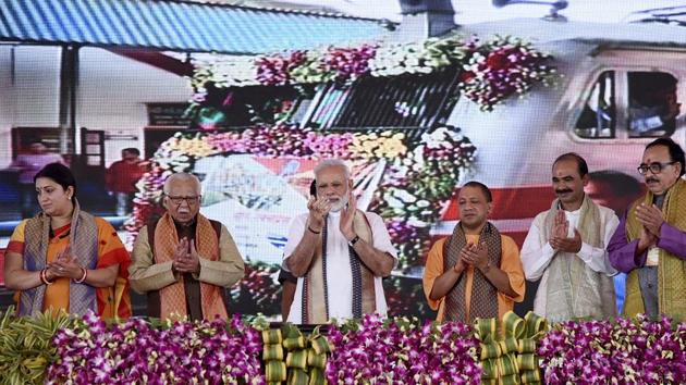 PM Narendra Modi with Union textiles minister Smriti Irani, UP governor Ram Naik and CM Yogi Adityanath and other leaders at the flag off ceremony of the Vadodara-Varanasi Mahamana Express in Varanasi.(PTI Photo) PM Narendra Modi with Union textiles minister Smriti Irani, UP governor Ram Naik and CM Yogi Adityanath and other leaders at the flag off ceremony of the Vadodara-Varanasi Mahamana Express in Varanasi.(PTI Photo)