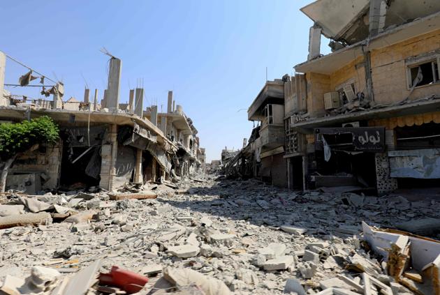 A general view shows destruction in the former Islamic State (IS) group stronghold of Raqa on September 21, 2017, as Syrian fighters backed by US special forces battle to clear the last remaining jihadists holed up in the city(AFP)