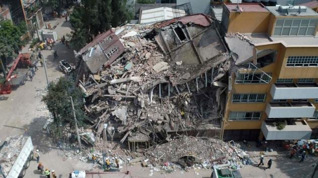 Aerial view of a flattened building in Mexico City taken on September 20, 2017 as the search for survivors continues two days after a strong quake hit central Mexico. (AFP Photo) Aerial view of a flattened building in Mexico City taken on September 20, 2017 as the search for survivors continues two days after a strong quake hit central Mexico. (AFP Photo)