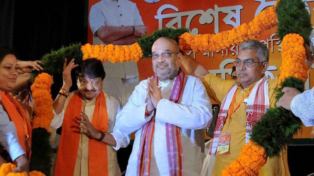 BJP National President Amit Shah being garlanded a during a party meeting at ICCR (Indian Council for Cultural Relations) in Kolkata.(PTI File Photo)