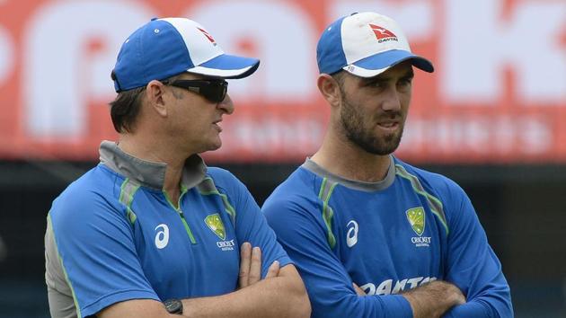 Australian cricketer Glenn Maxwell (R) speaks with team selector Mark Waugh during a training session at the Holkar Stadium in Indore on September 23, 2017.  (AFP) 