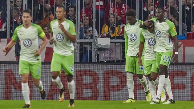 Wolfsburg's players celebrate their late equaliser against Bayern Munich at the Allianz Arena on Friday. (AFP) Wolfsburg's players celebrate their late equaliser against Bayern Munich at the Allianz Arena on Friday. (AFP)