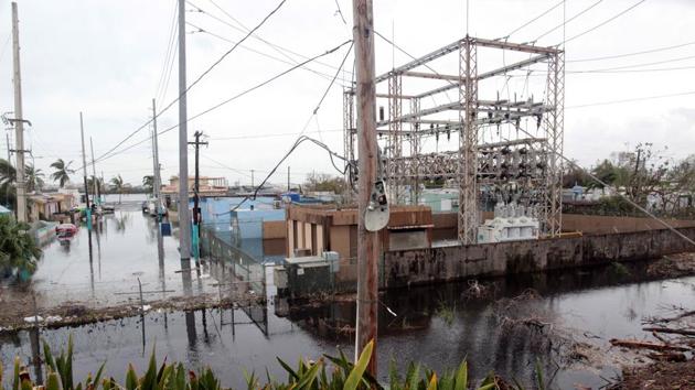 A neighbourhood is flooded after the area was hit by Hurricane Maria in San Juan, Puerto Rico. (REUTERS) A neighbourhood is flooded after the area was hit by Hurricane Maria in San Juan, Puerto Rico. (REUTERS)
