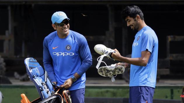 Dhoni and Jasprit Bumrah share a laugh at the practice session. (AP) Dhoni and Jasprit Bumrah share a laugh at the practice session. (AP)