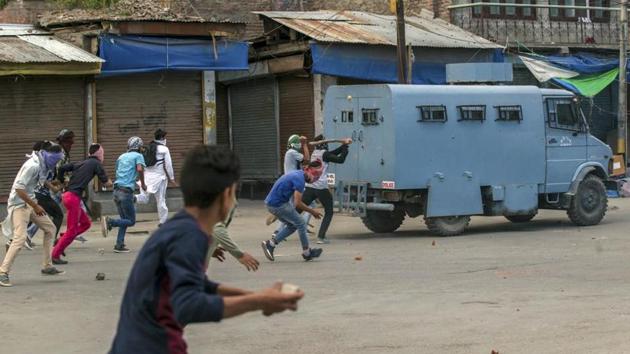 Kashmiri protester throws rocks and bricks at an armoured vehicle during a protest in Srinagar in May. (AP file photo) Kashmiri protester throws rocks and bricks at an armoured vehicle during a protest in Srinagar in May. (AP file photo)