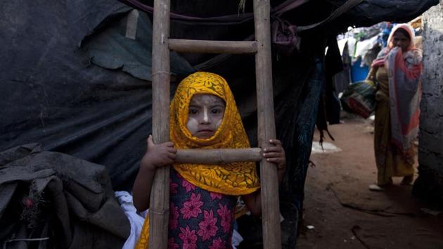 A Rohingya Muslim girl Yasmin Ara stands in front of her shanty at a camp for refugees in Hyderabad . India's government said Monday that it has evidence there are extremists who pose a threat to the country's security among the Rohingya Muslims who have fled Myanmar and settled in many Indian cities. India's Supreme Court was hearing a petition filed on behalf of two Rohingya refugees challenging a government decision to deport the ethnic group from India. (Mahesh Kumar A / AP) A Rohingya Muslim girl Yasmin Ara stands in front of her shanty at a camp for refugees in Hyderabad . India's government said Monday that it has evidence there are extremists who pose a threat to the country's security among the Rohingya Muslims who have fled Myanmar and settled in many Indian cities. India's Supreme Court was hearing a petition filed on behalf of two Rohingya refugees challenging a government decision to deport the ethnic group from India. (Mahesh Kumar A / AP)