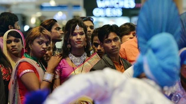 Indian transgenders look at a performance during a 'Hijra Habba' event with the theme 'All citizens equal - Inclusion', at a shopping mall in New Delhi. (MONEY SHARMA / AFP) Indian transgenders look at a performance during a 'Hijra Habba' event with the theme 'All citizens equal - Inclusion', at a shopping mall in New Delhi. (MONEY SHARMA / AFP)