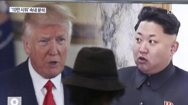 A man watches a TV screen showing US President Donald Trump, left, and North Korean leader Kim Jong Un during a news program at the Seoul Train Station in Seoul, South Korea.(AP File Photo)