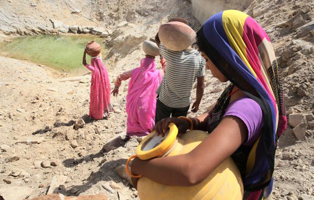 People from Pipalantri village in Rajasthan’s Rajsamand district collect groundwater from a water-harvested pond.(Himanshu Vyas/HT File Photo .)