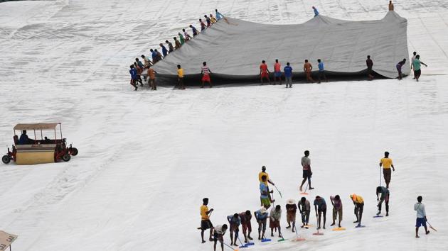 Indian ground staff uncover the pitch ahead of a training session for the forthcoming one day international (ODI) match in the ongoing India-Australia series at the Eden Gardens Cricket Stadium in Kolkata . India and Australia playing five ODIs and three Twenty20 matches during the tour, lasting nearly a month and started from September 17. (Dibyangshu SARKAR / AFP) Indian ground staff uncover the pitch ahead of a training session for the forthcoming one day international (ODI) match in the ongoing India-Australia series at the Eden Gardens Cricket Stadium in Kolkata . India and Australia playing five ODIs and three Twenty20 matches during the tour, lasting nearly a month and started from September 17. (Dibyangshu SARKAR / AFP)