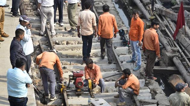 A file photo od repair work of railway track being carried out after last coach of Jammu Rajdhani Express train derailed in New Delhi on September 14.(Arvind Yadav/HT Photo)