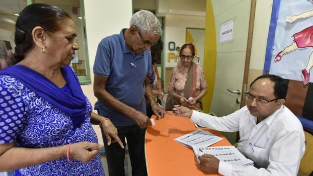 A voter gets his finger inked to exercise his franchise in the Municipal Corporation of Gurugram (MCG) election at a polling booth in Gurgaon on Sunday. A voter gets his finger inked to exercise his franchise in the Municipal Corporation of Gurugram (MCG) election at a polling booth in Gurgaon on Sunday.