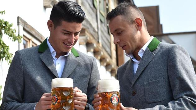 Bayern Munich's Colombian midfielder James Rodriguez (L) and defender Rafinha hold beer mugs as they pose during the traditional visit of members of German first division Bundesliga football club Bayern Munich at the Oktoberfest beer festival in Munich, Germany. (AFP) Bayern Munich's Colombian midfielder James Rodriguez (L) and defender Rafinha hold beer mugs as they pose during the traditional visit of members of German first division Bundesliga football club Bayern Munich at the Oktoberfest beer festival in Munich, Germany. (AFP)