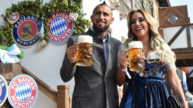 Bayern Munich's Chilean midfielder Arturo Vidal and his wife Maria Teresa Matus hold beer mugs as they pose during the traditional visit of members of German first division Bundesliga football club Bayern Munich at the Oktoberfest beer festival in Munich, Germany. (AFP) Bayern Munich's Chilean midfielder Arturo Vidal and his wife Maria Teresa Matus hold beer mugs as they pose during the traditional visit of members of German first division Bundesliga football club Bayern Munich at the Oktoberfest beer festival in Munich, Germany. (AFP)