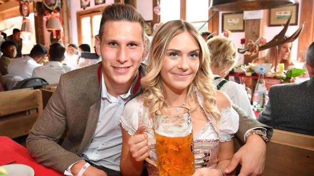 Bayern Munich's German defender Niklas Suele and his girlfriend Melissa Halte pose during the traditional visit of FC Bayern Munich to the Oktoberfest beer festival in Munich, Germany. (AFP) Bayern Munich's German defender Niklas Suele and his girlfriend Melissa Halte pose during the traditional visit of FC Bayern Munich to the Oktoberfest beer festival in Munich, Germany. (AFP)