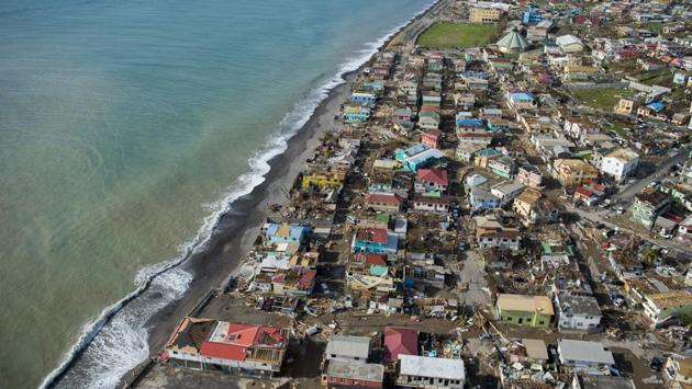 An aerial view of Roseau, capital of the Caribbean island Dominica, shows destruction on September 21, 2017, three days after passage of Hurricane Maria. Dominica, located near the French islands of Martinique and Guadeloupe, has been almost completely cut off from the world since the impact of the hurricane. (Lionel Chamoiseau / AFP) An aerial view of Roseau, capital of the Caribbean island Dominica, shows destruction on September 21, 2017, three days after passage of Hurricane Maria. Dominica, located near the French islands of Martinique and Guadeloupe, has been almost completely cut off from the world since the impact of the hurricane. (Lionel Chamoiseau / AFP)