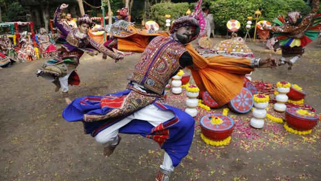 Performers wearing traditional attire practice Garba, a dance of Gujarat state, ahead of Navratri festival in Ahmadabad.(AP File Photo)