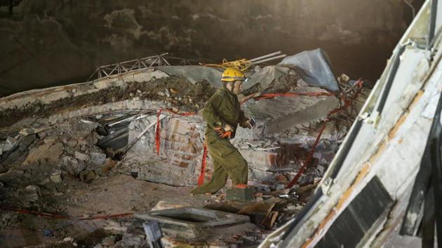 Rescue team searches for survivors in the rubble of a collapsed building after an earthquake in Mexico City. (Reuters)