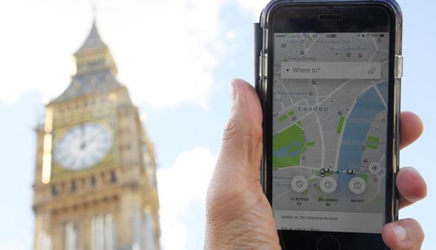 A person look at the Uber app on a mobile phone in London. (REUTERS File Photo) (REUTERS) A person look at the Uber app on a mobile phone in London. (REUTERS File Photo) (REUTERS)