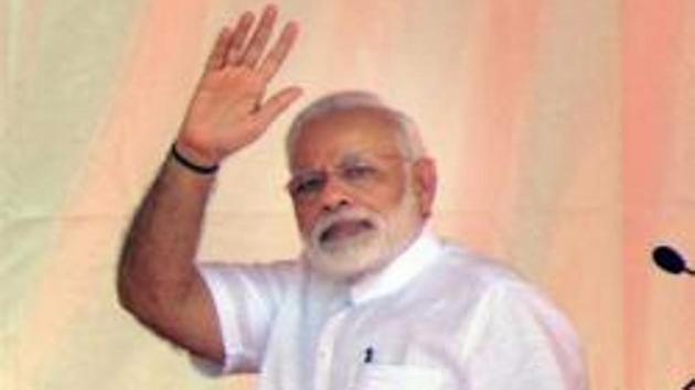 Prime Minister Narendra Modi waves to the crowd during the distributing the certificate to beneficiaries of the Pradhan Mantri Awas Yojana (Rural & Urban) at Shahanshahpur look on, Varanasi, Uttar Pradesh. (PTI File Photo) Prime Minister Narendra Modi waves to the crowd during the distributing the certificate to beneficiaries of the Pradhan Mantri Awas Yojana (Rural & Urban) at Shahanshahpur look on, Varanasi, Uttar Pradesh. (PTI File Photo)