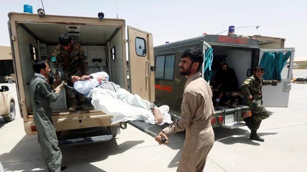 Afghan military medical personnel take an injured member of the Afghan security forces off an ambulance, prior to air transport for treatment in Kabul, at the Kandahar military Airport, Afghanistan.(REUTERS File) Afghan military medical personnel take an injured member of the Afghan security forces off an ambulance, prior to air transport for treatment in Kabul, at the Kandahar military Airport, Afghanistan.(REUTERS File)