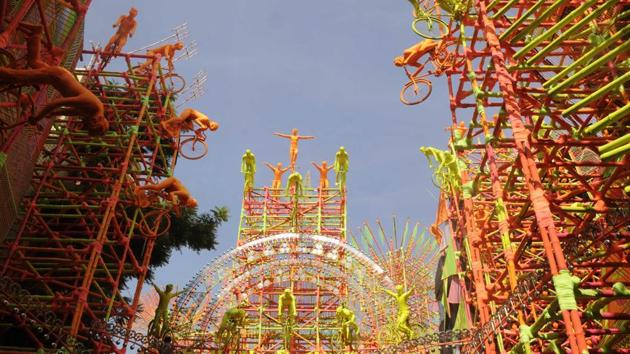 The 33 Pally Durga Puja at Beleghata in Kolkata takes on the theme of the ‘Cycle of Life’ with detailed installations of human figures and colourful cycles looming large over the pandal.  (Samir Jana / HT Photo) 