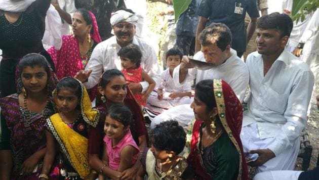Rahul Gandhi sips tea with an Ahir family at Handpara village on Monday on the first day of Navsarjan Yatra. (HT Photo)
