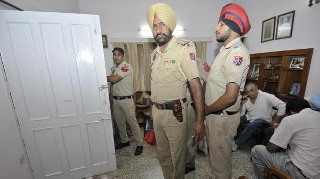 A police team at KJ Singh’s house in Phase 3B2, Mohali.(HT File)