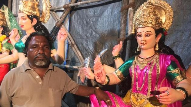 Ashok Prabhulkar with an idol he dressed.