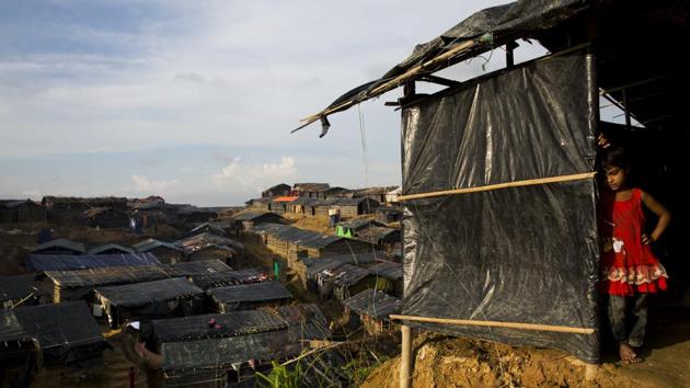 A newly arrived Rohingya Muslim girl leans on her family shelter in Balukhali refugee camp, Bangladesh, September 24. (AP) A newly arrived Rohingya Muslim girl leans on her family shelter in Balukhali refugee camp, Bangladesh, September 24. (AP)