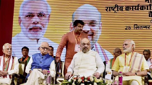 Prime Minister Narendra Modi (R) with BJP President Amit Shah (C) and senior party leaders LK Advani and MM Joshi at Talkatora stadium in New Delhi on Monday. (PTI) Prime Minister Narendra Modi (R) with BJP President Amit Shah (C) and senior party leaders LK Advani and MM Joshi at Talkatora stadium in New Delhi on Monday. (PTI)