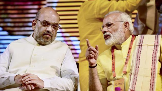 Prime Minister Narendra Modi and BJP President Amit Shah at party's national executive meeting at Talkatora stadium, in New Delhi on Monday.(PTI Photo)