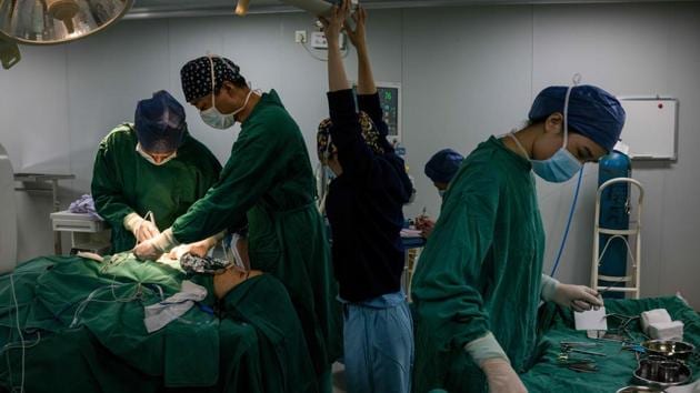 In this photograph taken on August 22, 2017, Chen Yan, 35, undergoes a plastic surgery procedure at Huamei Medical Cosmetology Hospital in Shanghai. Plastic surgery is booming in China, fuelled by rising incomes, growing Western influences and the imperative of looking good on social media.(AFP)