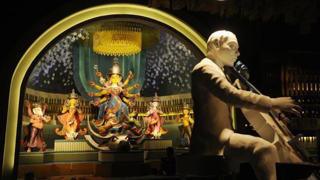 The pandal at Kashi Bose Lane in North Kolkata is themed on music, spanning old and new songs. Taking visitors down memory lane by using music as a theme, artist Pradip Das has also designed the soundscape in detail. (Samir Jana / HT Photo) 