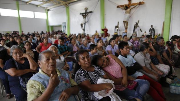People attend Mass inside an auditorium in Tepeojuma, Mexico on September 24. (AP Photo) People attend Mass inside an auditorium in Tepeojuma, Mexico on September 24. (AP Photo)
