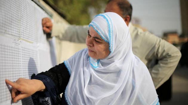 People look for their names in the lists at a polling station in Erbil, Iraq on September 25, 2017. A total of 12,072 polling stations are open for more than 5.3 million registered voters. Polling stations are scattered across the three northern provinces of autonomous Iraqi Kurdistan -- Erbil, Sulaimaniyah and Dohuk -- as well as in disputed bordering zones such as the oil-rich province of Kirkuk where mosque loudspeakers blared out calls for residents to take part in the vote.. (Ahmed Jadallah / REUTERS) People look for their names in the lists at a polling station in Erbil, Iraq on September 25, 2017. A total of 12,072 polling stations are open for more than 5.3 million registered voters. Polling stations are scattered across the three northern provinces of autonomous Iraqi Kurdistan -- Erbil, Sulaimaniyah and Dohuk -- as well as in disputed bordering zones such as the oil-rich province of Kirkuk where mosque loudspeakers blared out calls for residents to take part in the vote.. (Ahmed Jadallah / REUTERS)